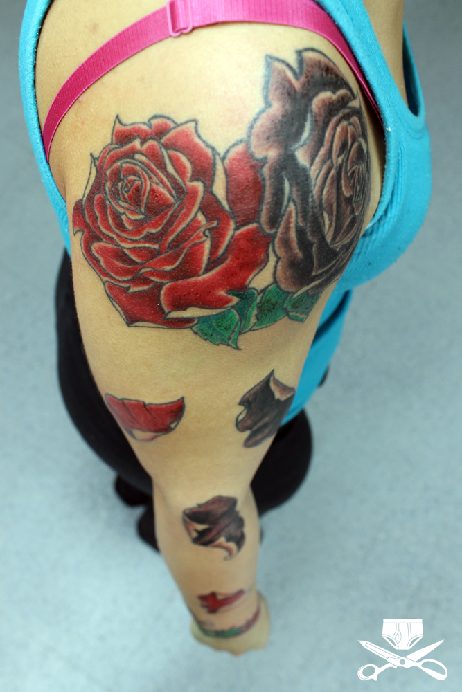 roses with falling petals arm tattoo hautedraws